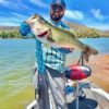Happy angler showing a monster largemouth bass catch at the Picachos lake. Lake Picachos, Mazatlan, Sinaloa.