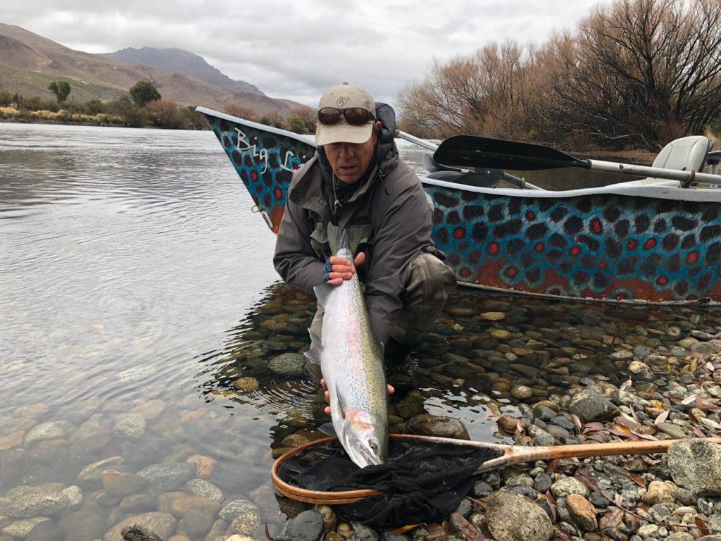 Angler with rainbow trout