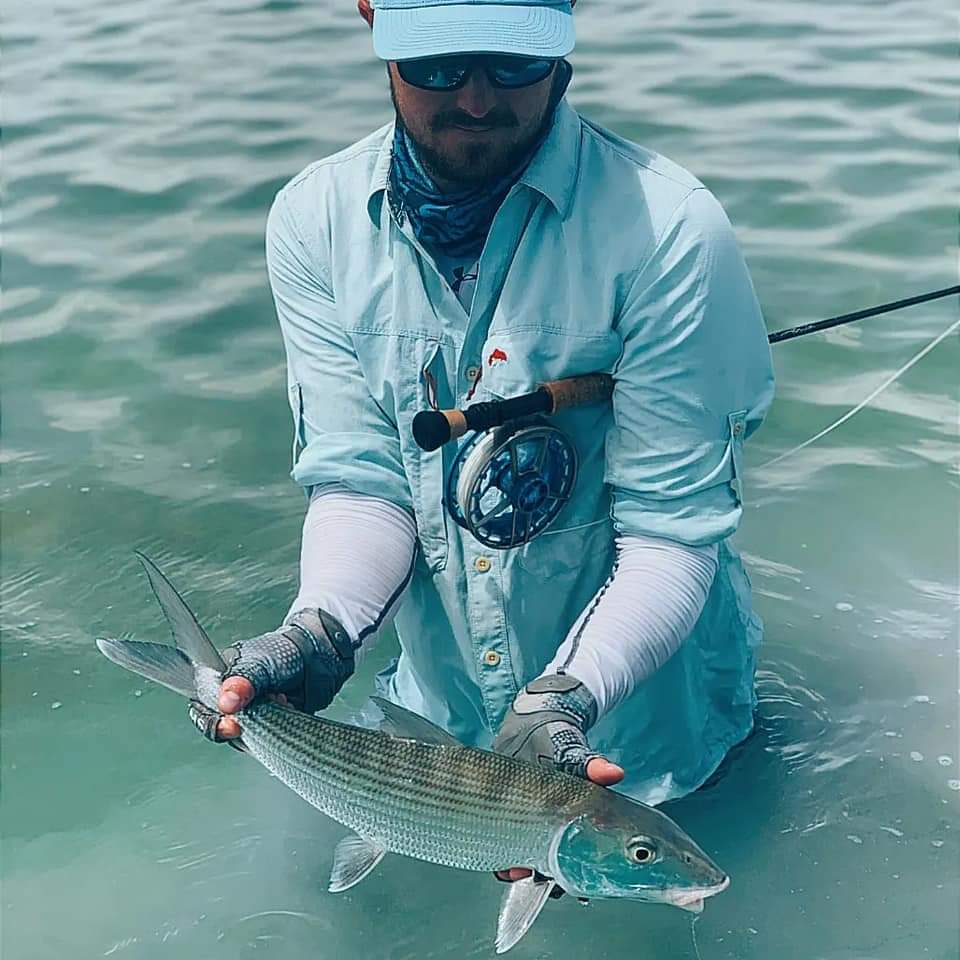 Sport fisherman releases a baby tarpon in Chetumal Mexico