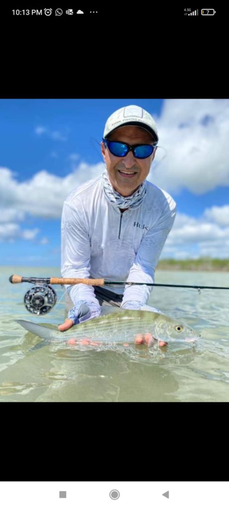 Angler catches a baby tarpon with fly fishing technique in Chetumal Mexico