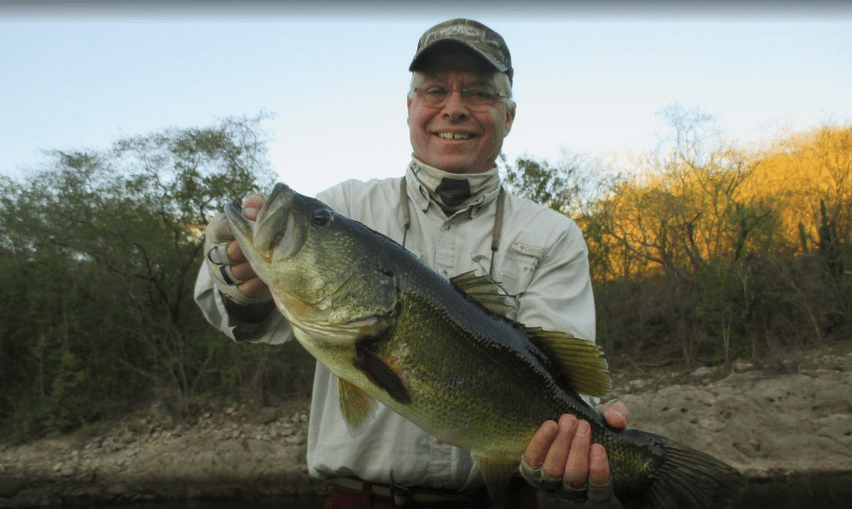 Angler with largemouth bass Lake El Salto Sinaloa 02