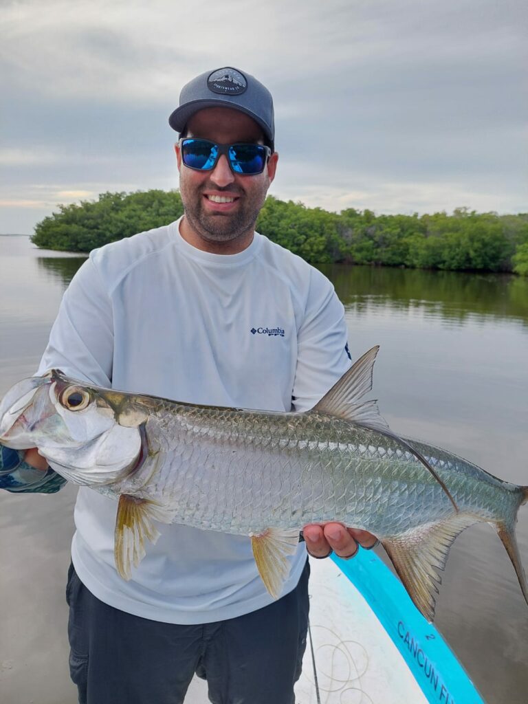 Angler with a tarpoon at Cancun Quintana Roo