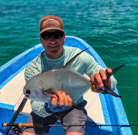 Angler with permit at Punta Allen Quintana Roo