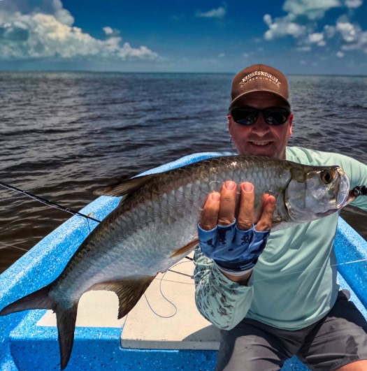 Angler with tarpoon at Punta Allen Quintana Roo