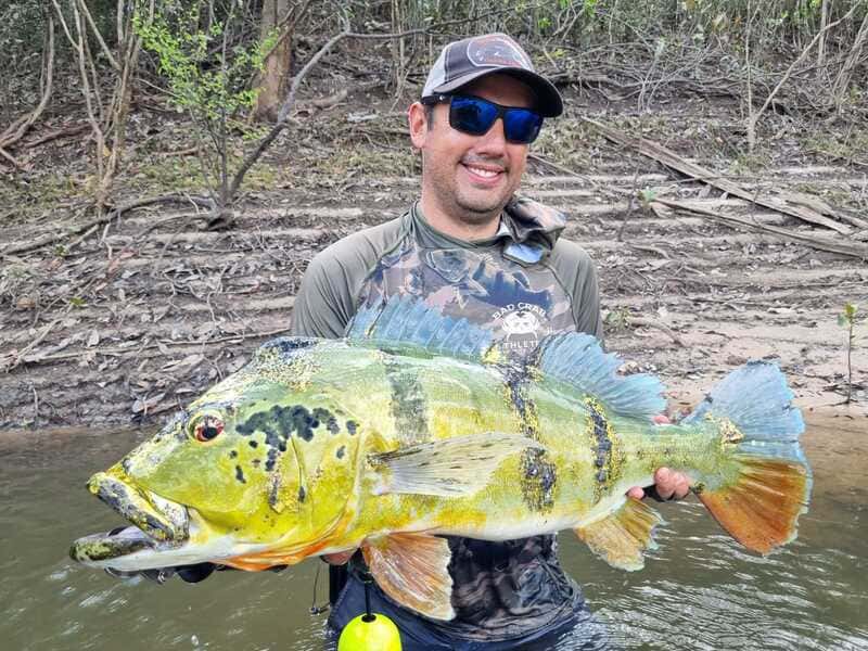 Happy angler with peacock bass catch at Cano Gavilan Vichada Colombia