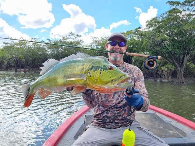 Proud Angler with peacock bass catch Cano Gavilan Vichada Colombia
