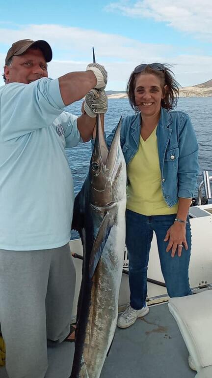 angler with marlin catch at los cabos san lucas