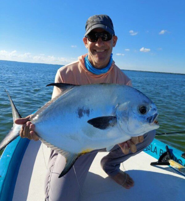 Proud Angler with his incredible Permit Catch at Cancun