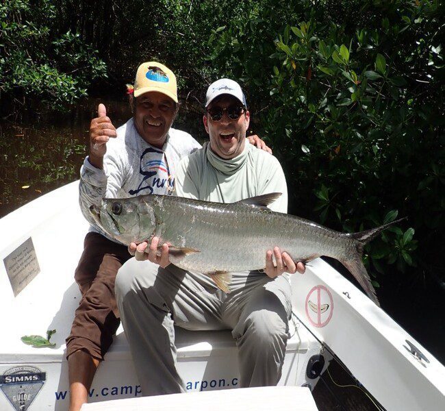 Happy anglers showing of their incredible juvenile tarpon catch at Campeche