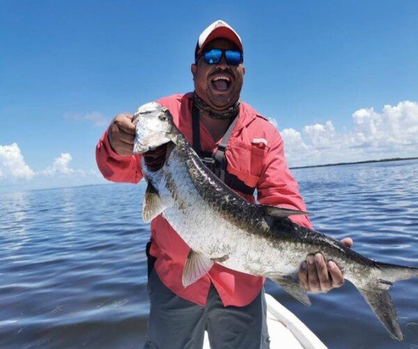 Happy Angler and his beautiful Juvenile Tarpon catch at Tarpon Island Isla Sabalo