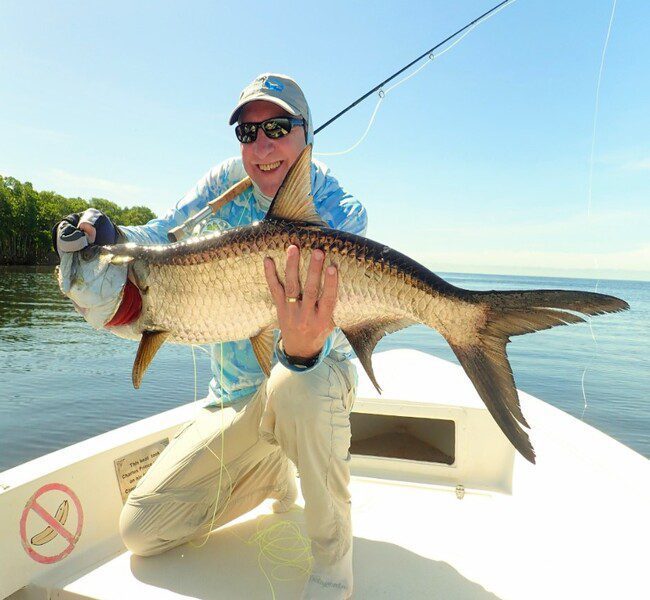 Happy anglers showing of their amazing juvenile tarpon catch at Campeche