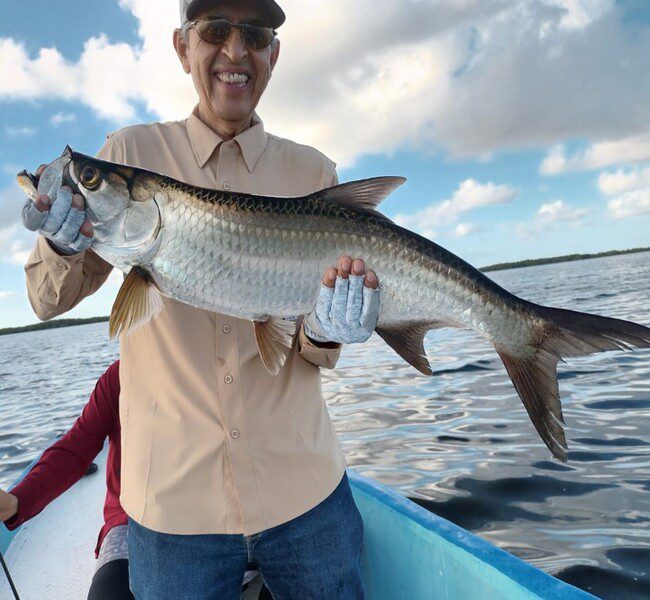 Happy angler with whis great juvenile tarpon catch at San Felipe and Rio Lagartos