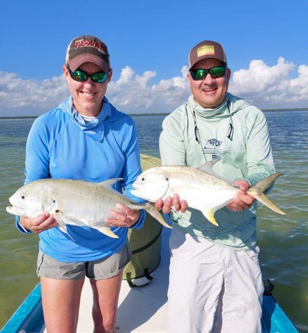 Happy anglers with their double catch at Cancun