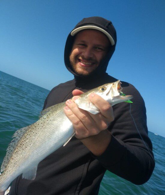 Happy angler and his beautiful spotted trout catch at Celestun